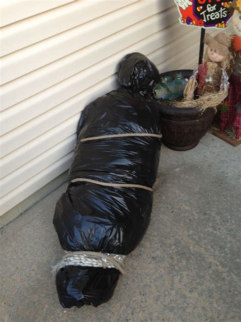 fake body bag halloween|halloween dolls carrying body bag.